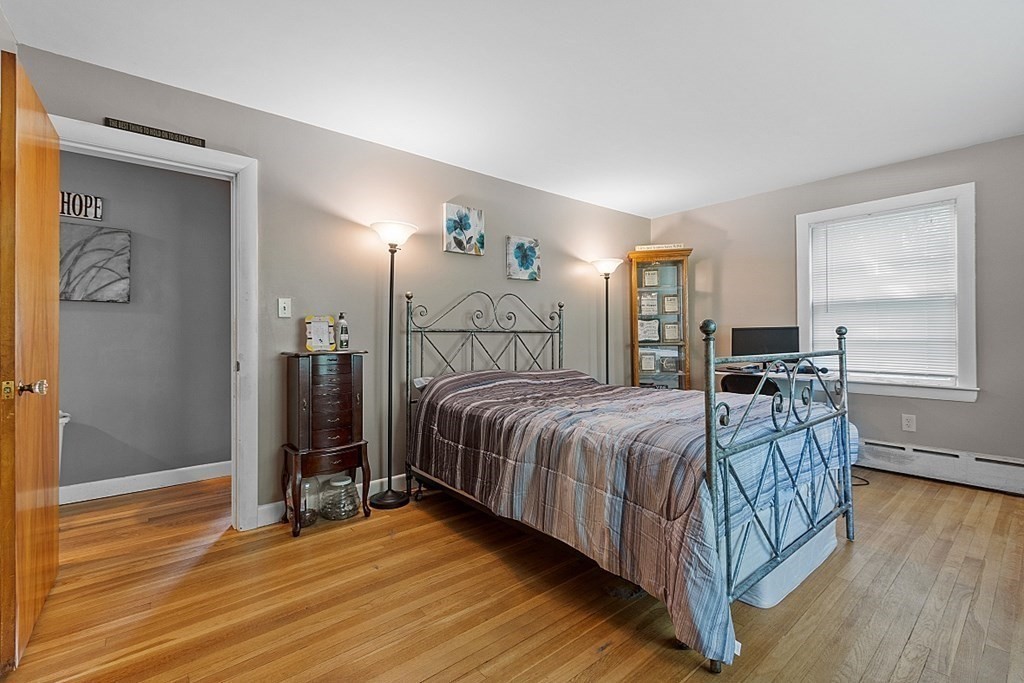 85 Blood Road Charlton, MA 01507 - Photo 16 of 30 a bedroom with a bed and wooden floor