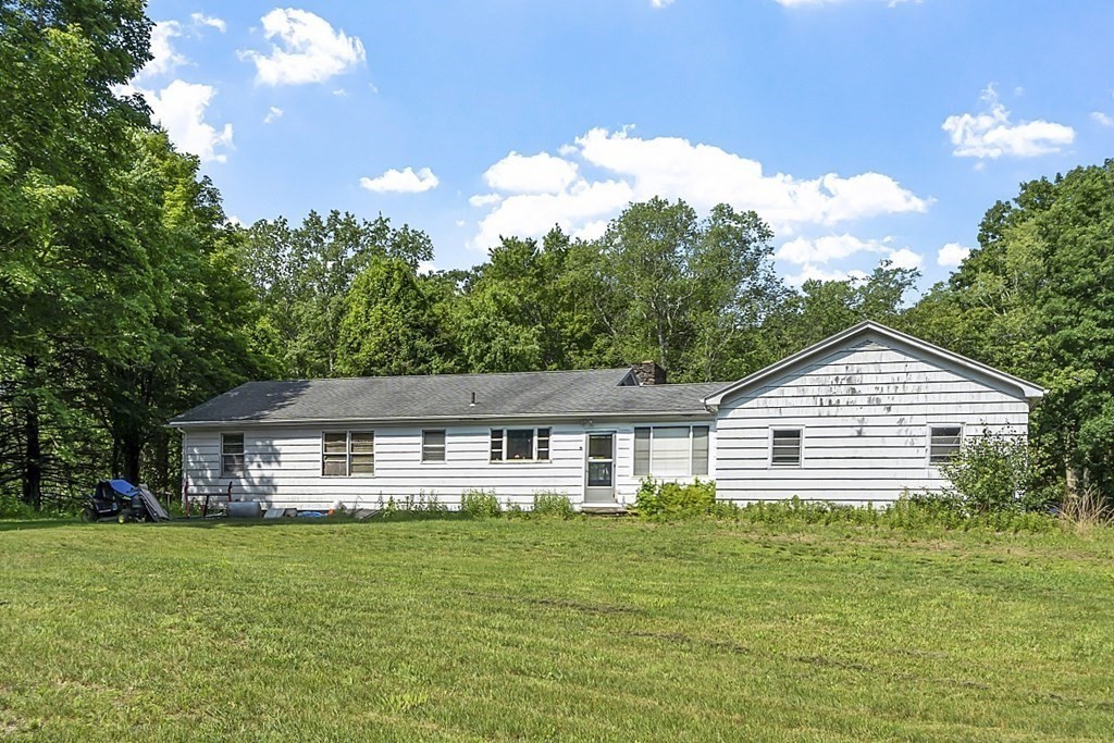 85 Blood Road Charlton, MA 01507 - Photo 4 of 30 a front view of a house with a garden
