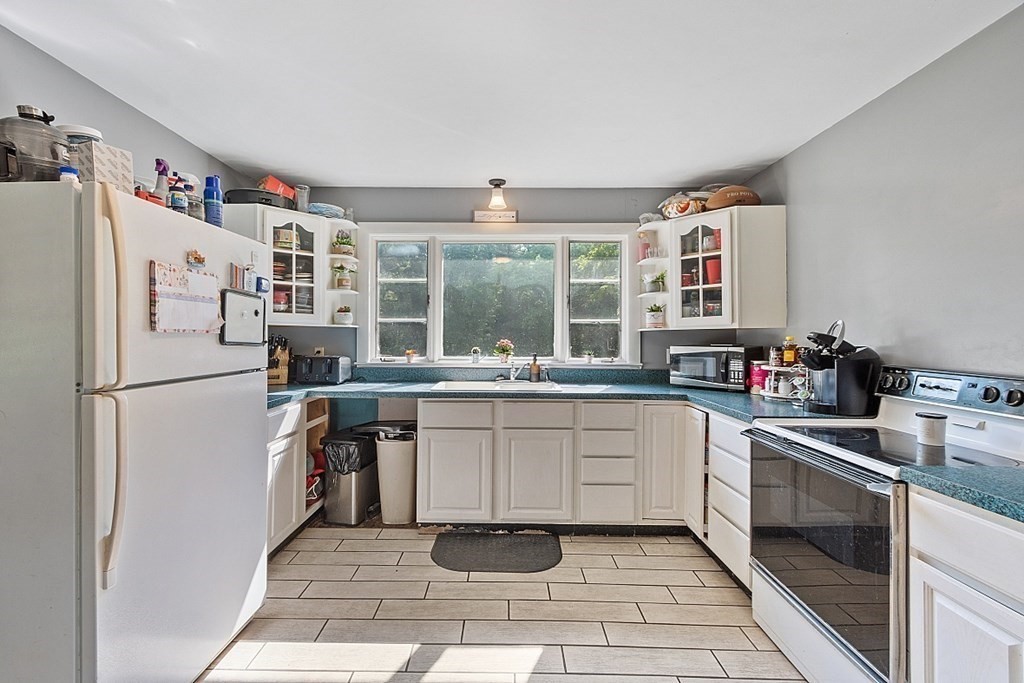 85 Blood Road Charlton, MA 01507 - Photo 7 of 30 a kitchen with stainless steel appliances granite countertop a refrigerator sink and white cabinets