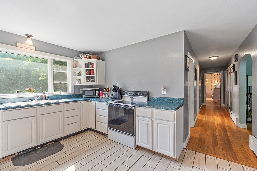 85 Blood Road Charlton, MA 01507 - Photo 8 of 30 a kitchen with stainless steel appliances granite countertop a stove and a sink