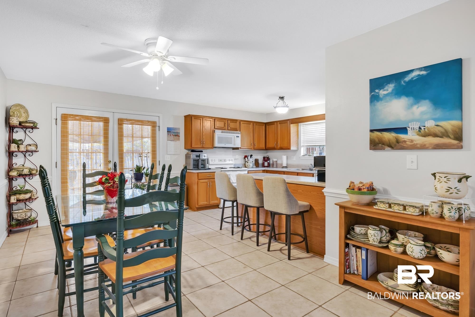 105 Cluster Oaks Court Foley, AL 36535 - Photo 14 of 26 Dining area with light tile patterned floors and ceiling fan