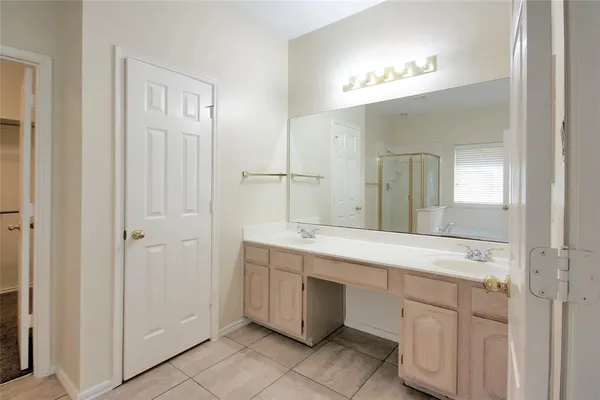 a bathroom with a bathtub and shower