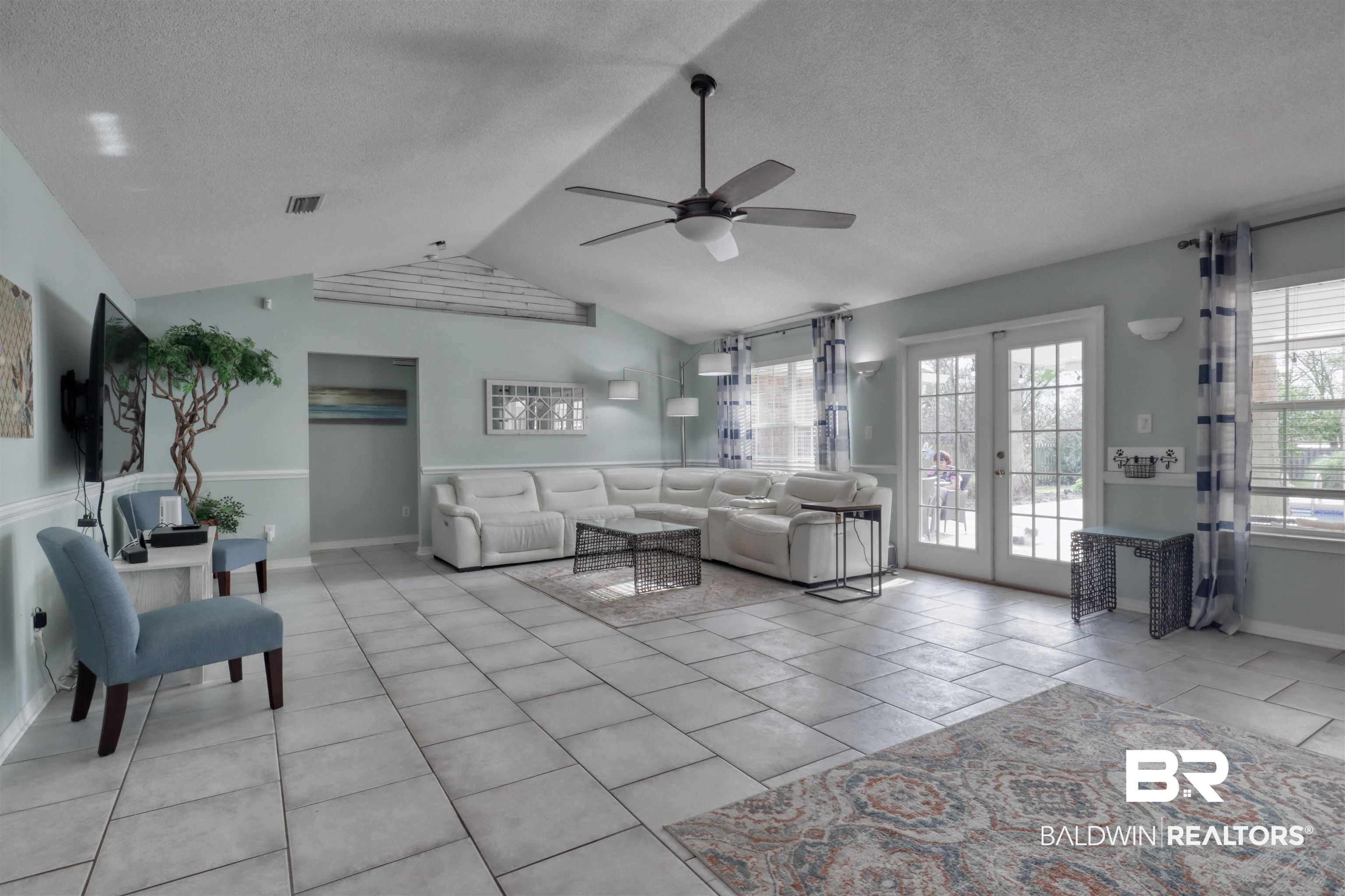 12893 Hunters Chase Foley, AL 36535 - Photo 17 of 42 Living area with plenty of natural light, visible vents, ceiling fan, and french doors