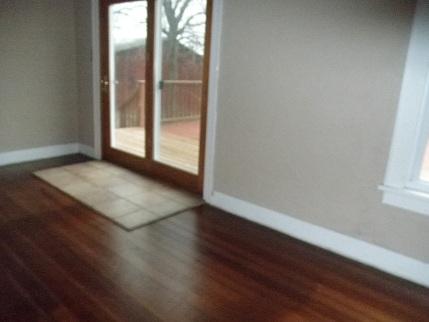 768 North 43rd Road Mendota, IL 61342 - Photo 2 of 12 an empty room with wooden floor and windows