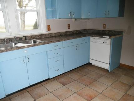768 North 43rd Road Mendota, IL 61342 - Photo 4 of 12 a kitchen with granite countertop white cabinets and sink