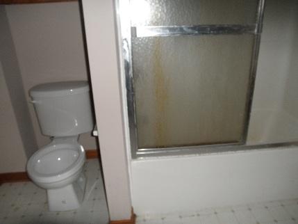 768 North 43rd Road Mendota, IL 61342 - Photo 6 of 12 a bathroom with a granite countertop toilet and a sink