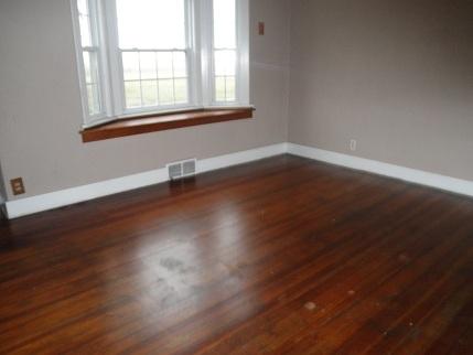 768 North 43rd Road Mendota, IL 61342 - Photo 10 of 12 an empty room with wooden floor and windows