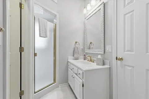 a bathroom with a double vanity sink and mirror