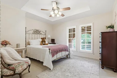 a bed room with a bed and a chair