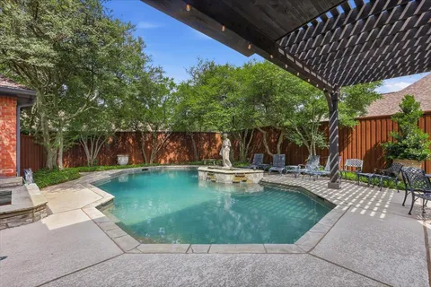 a view of a backyard with sitting area