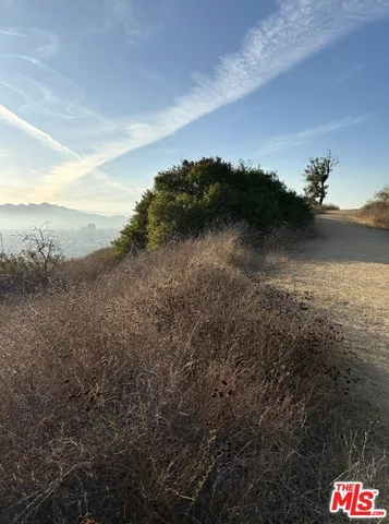 a view of an outdoor space and a mountain view in back