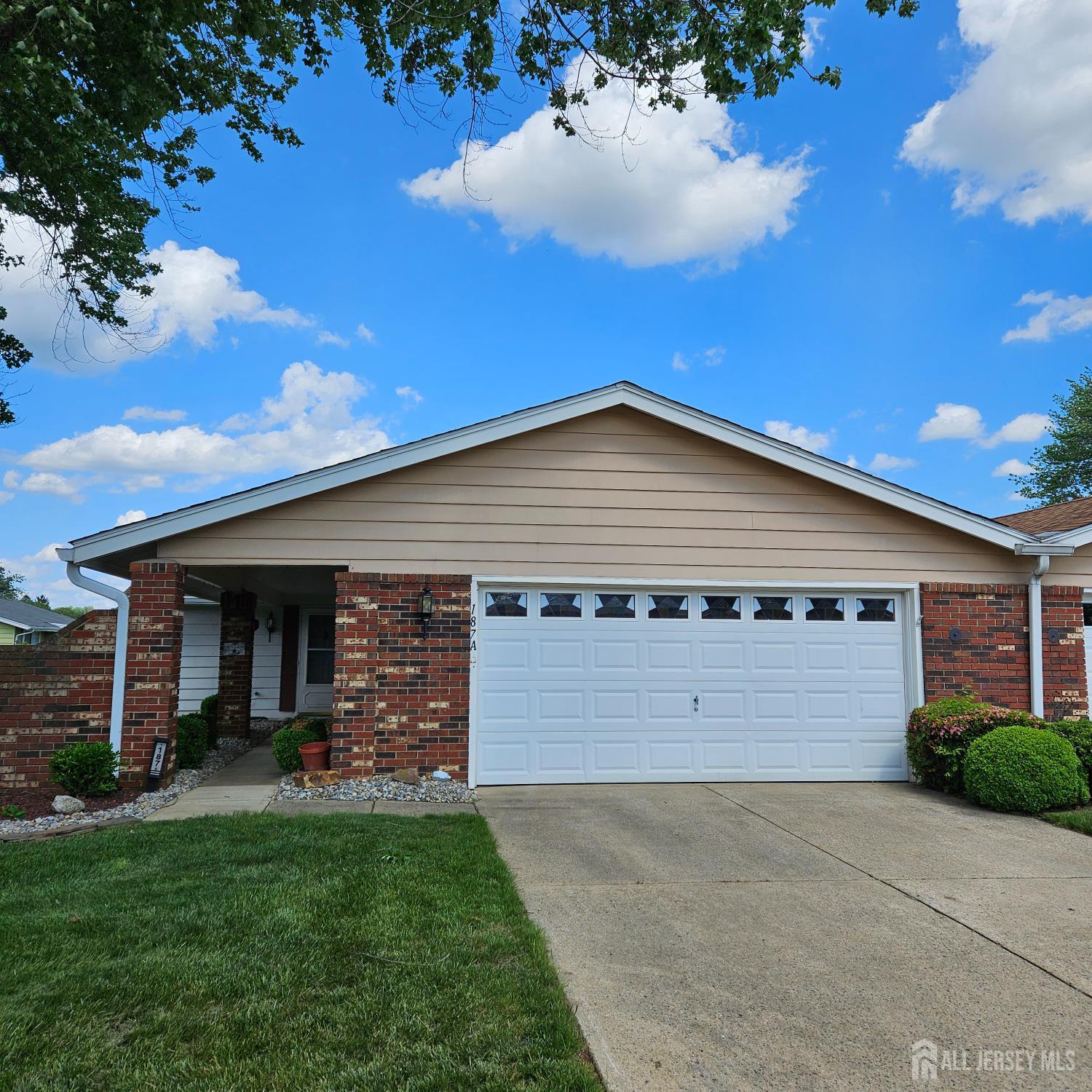 187 Newport Road, Unit A Monroe Township, NJ 08831 - Photo 1 of 26 a view of a back yard of the house