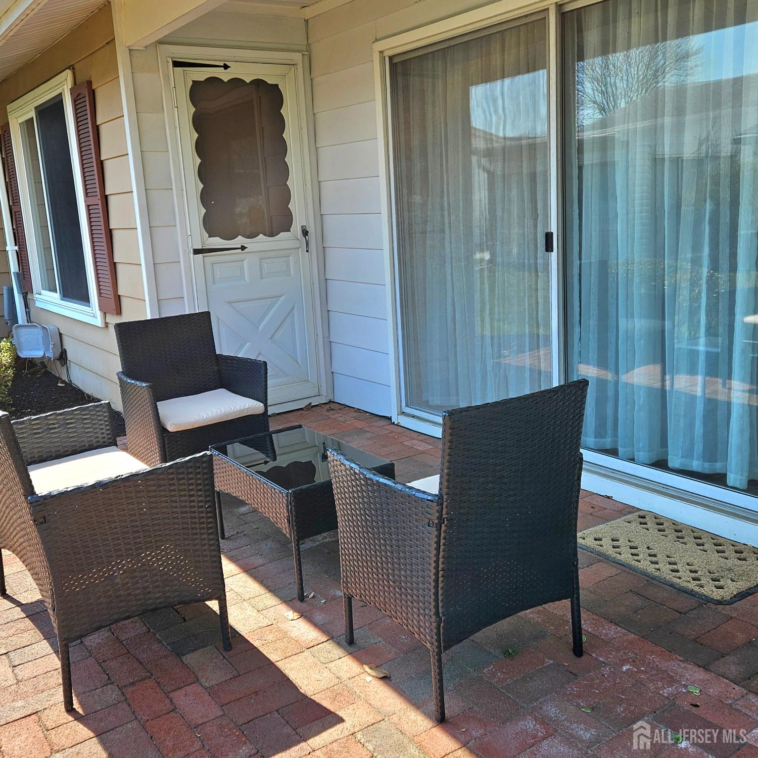 187 Newport Road, Unit A Monroe Township, NJ 08831 - Photo 26 of 26 a living room with couches a flat screen tv and fireplace