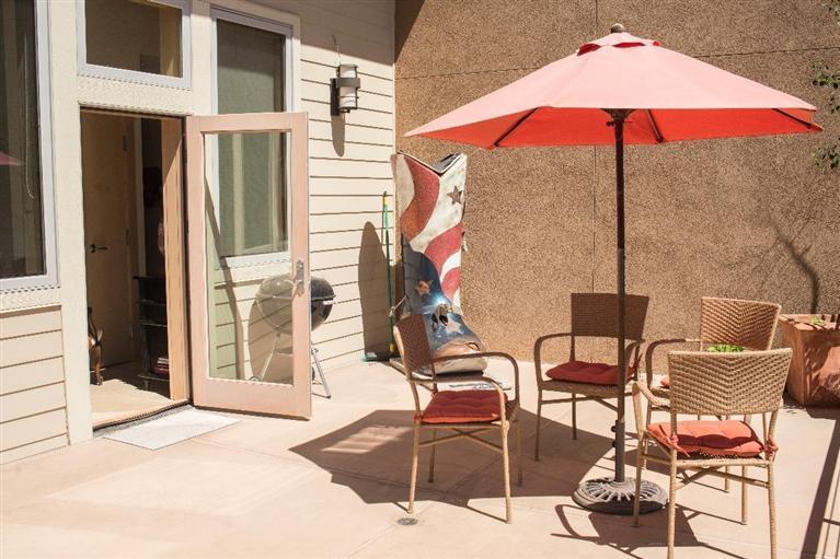 1020 Capitol Street, Unit R2 Eagle, CO 81631 - Photo 14 of 22 a view of a tables and chairs under an umbrella