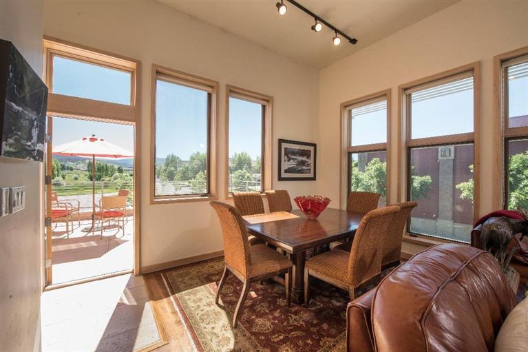 1020 Capitol Street, Unit R2 Eagle, CO 81631 - Photo 4 of 22 a view of a dining room with furniture large windows and wooden floor