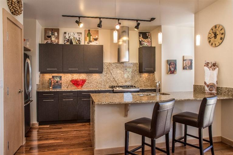 1020 Capitol Street, Unit R2 Eagle, CO 81631 - Photo 6 of 22 a kitchen with granite countertop sink cabinets and stainless steel appliances