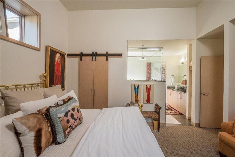 1020 Capitol Street, Unit R2 Eagle, CO 81631 - Photo 7 of 22 a bedroom with a bed and a mirror