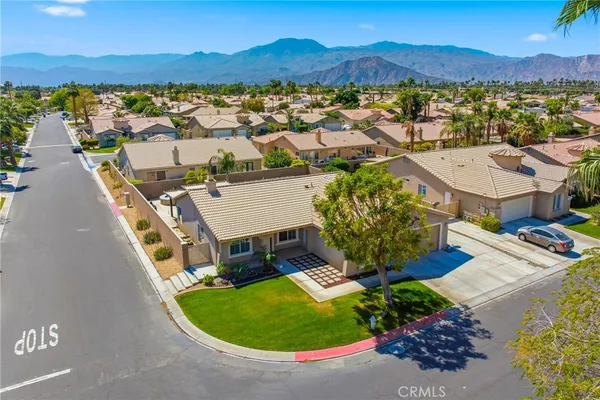 an aerial view of a house with a garden