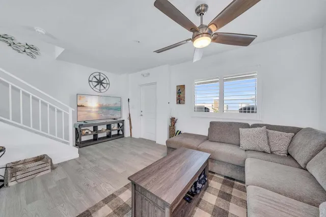 a kitchen with stainless steel appliances granite countertop a sink and cabinets with wooden floor
