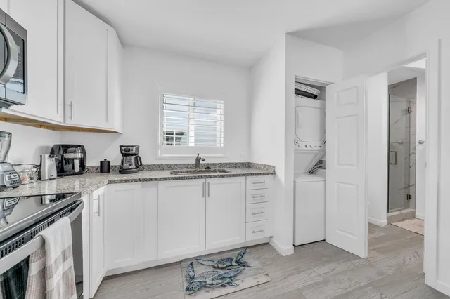 a bedroom with a bed and a night stand