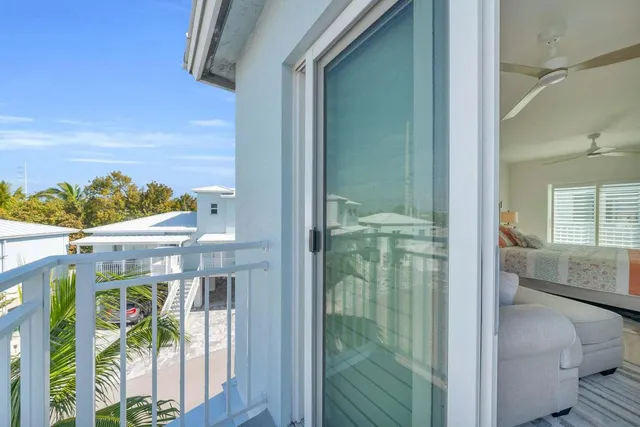 a bathroom with a granite countertop sink a mirror and shower