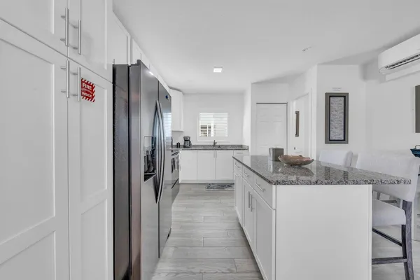 a kitchen with cabinets a sink and appliances