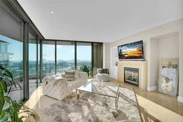 a living room with furniture fireplace and a flat screen tv