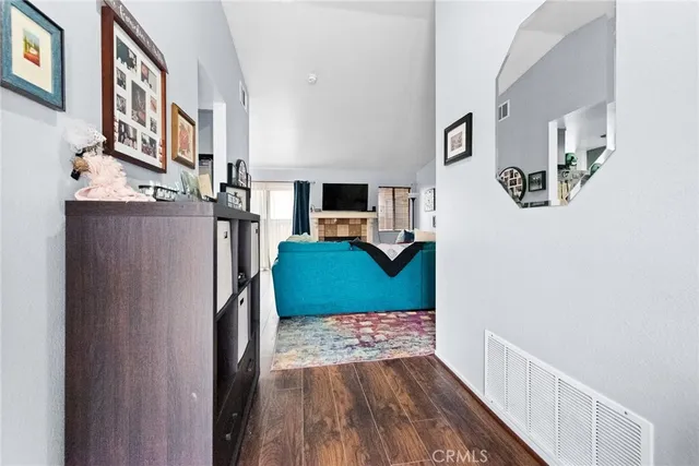 a view of a living room with furniture and a flat screen tv