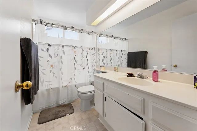 a roof deck with a table and chairs