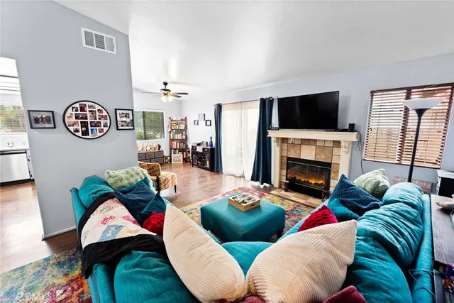 a living room with furniture and a fireplace