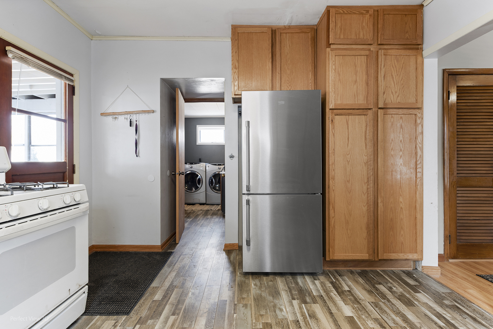 733 North 13th Street DeKalb, IL 60115 - Photo 11 of 22 a kitchen with stainless steel appliances a refrigerator and a stove top oven