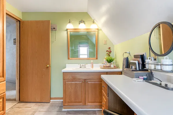 a bathroom with a sink and a mirror