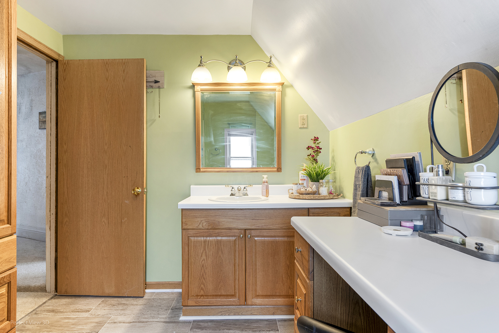 733 North 13th Street DeKalb, IL 60115 - Photo 15 of 22 a bathroom with a sink and a mirror