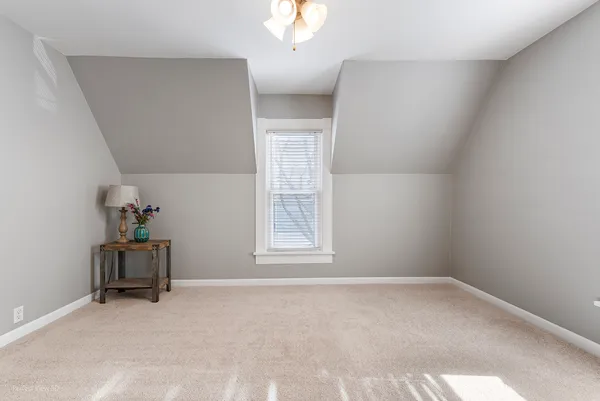 a view of room with workspace and windows