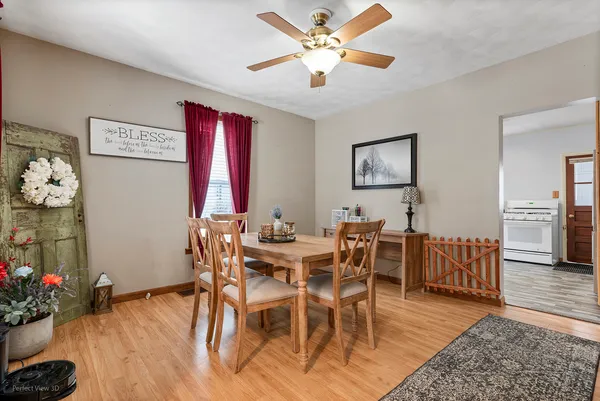 a view of a dining room with furniture and wooden floor