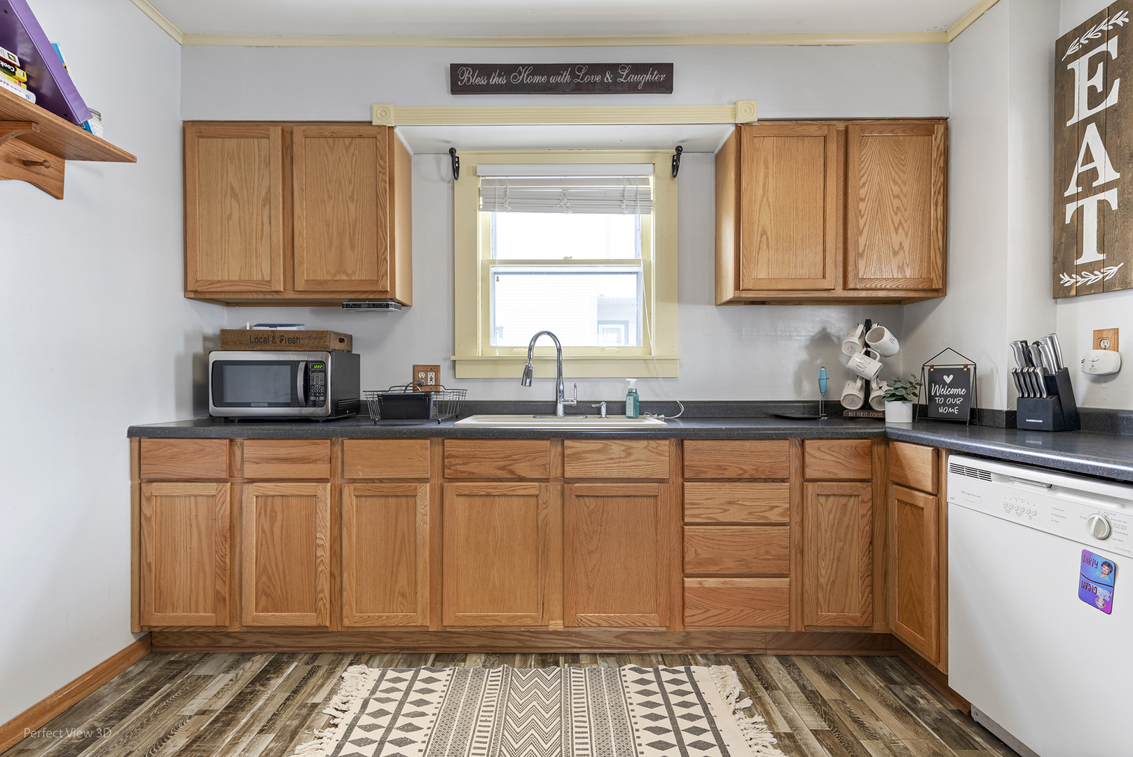 733 North 13th Street DeKalb, IL 60115 - Photo 10 of 22 a kitchen with stainless steel appliances a sink stove and cabinets