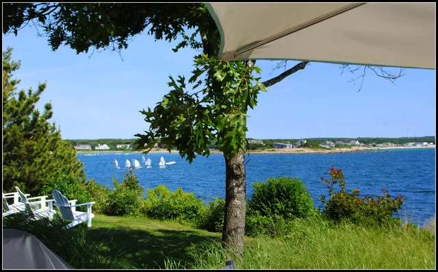a spacious bedroom with a bed and glass window