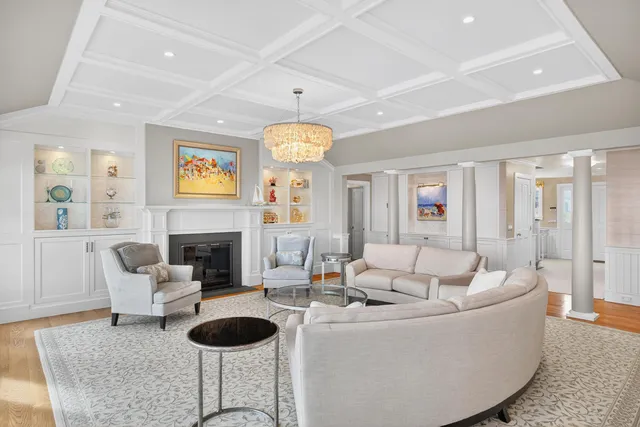 a view of a dining room with furniture wooden floor and chandelier
