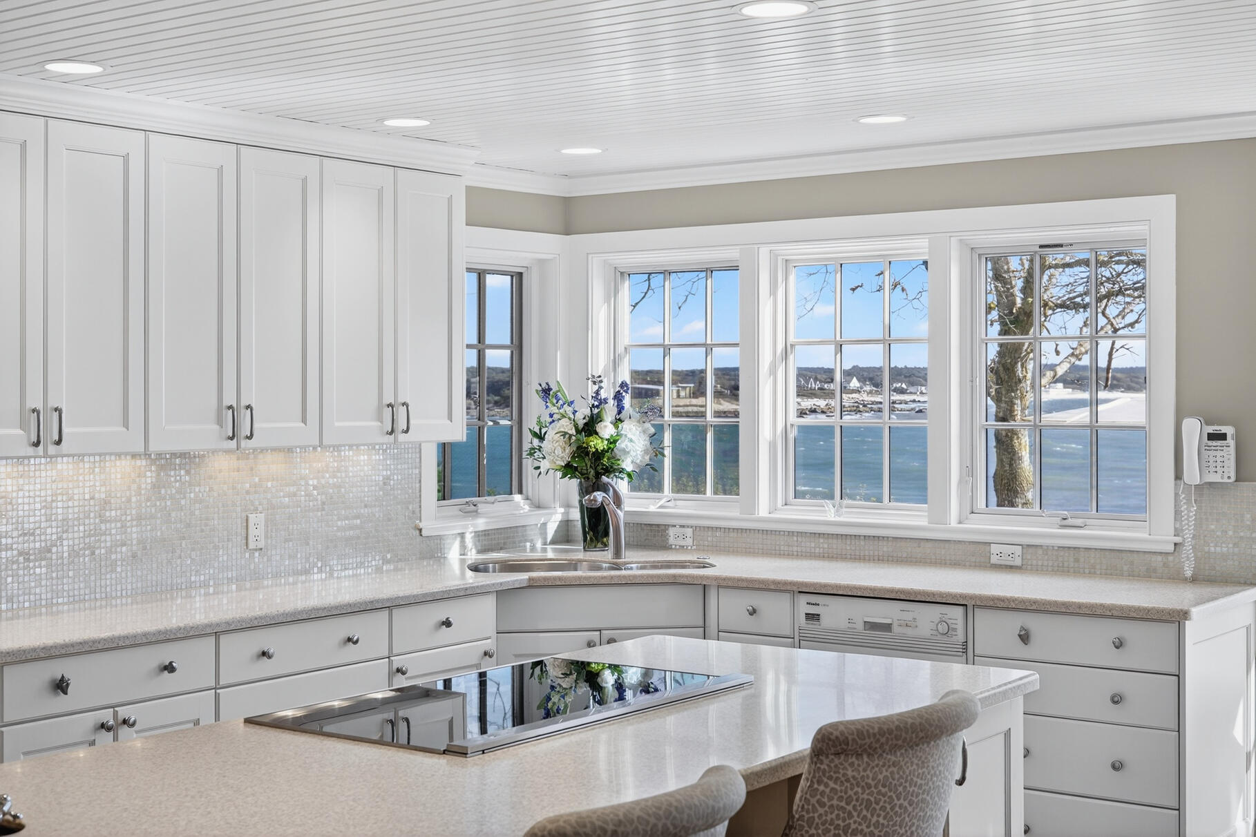 40 Point Road North Falmouth, MA 02556 - Photo 25 of 73 a kitchen with granite countertop a sink and white cabinets