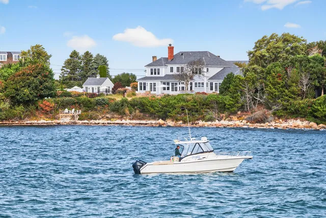 a aerial view of a house with swimming pool and patio