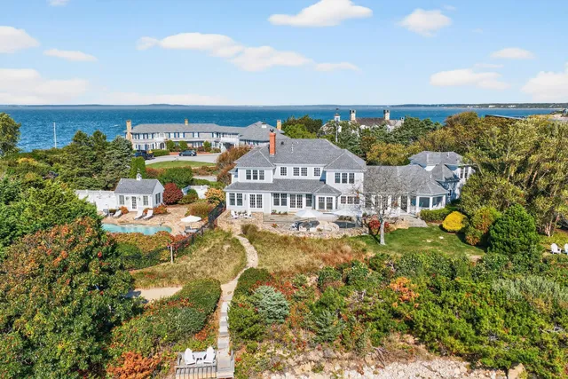 a view of a dining room with furniture wooden floor and chandelier