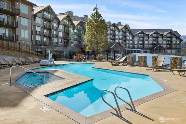 a view of a patio with swimming pool