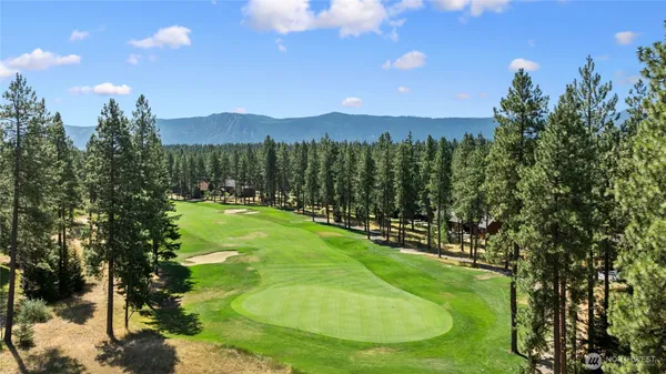 a view of a golf course with a swimming pool