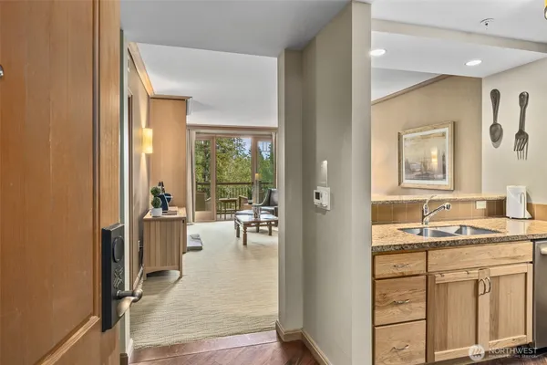 a en suite bathroom with a sink mirror and a bathtub