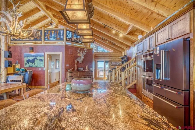 a view of a chairs and a table in the patio