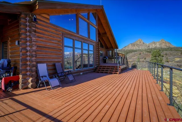 a view of a chairs on the roof deck