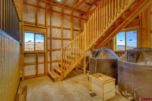 a view of an empty room with windows