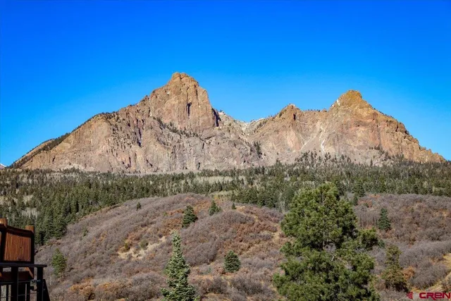 a view of a large building with a mountain in the background