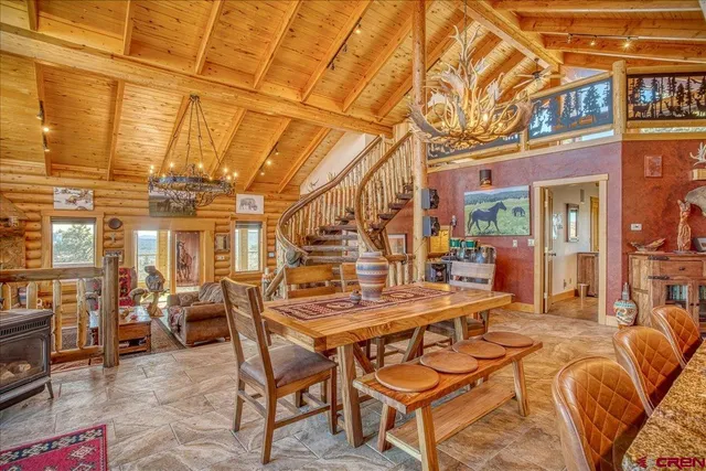 a view of a patio with table and chairs and potted plants