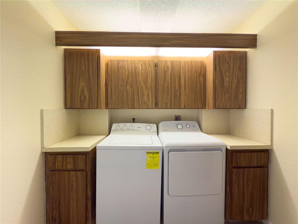 1701 Whitehall Drive, Unit 303 Davie, FL 33324 - Photo 14 of 33 a utility room with dryer and washer